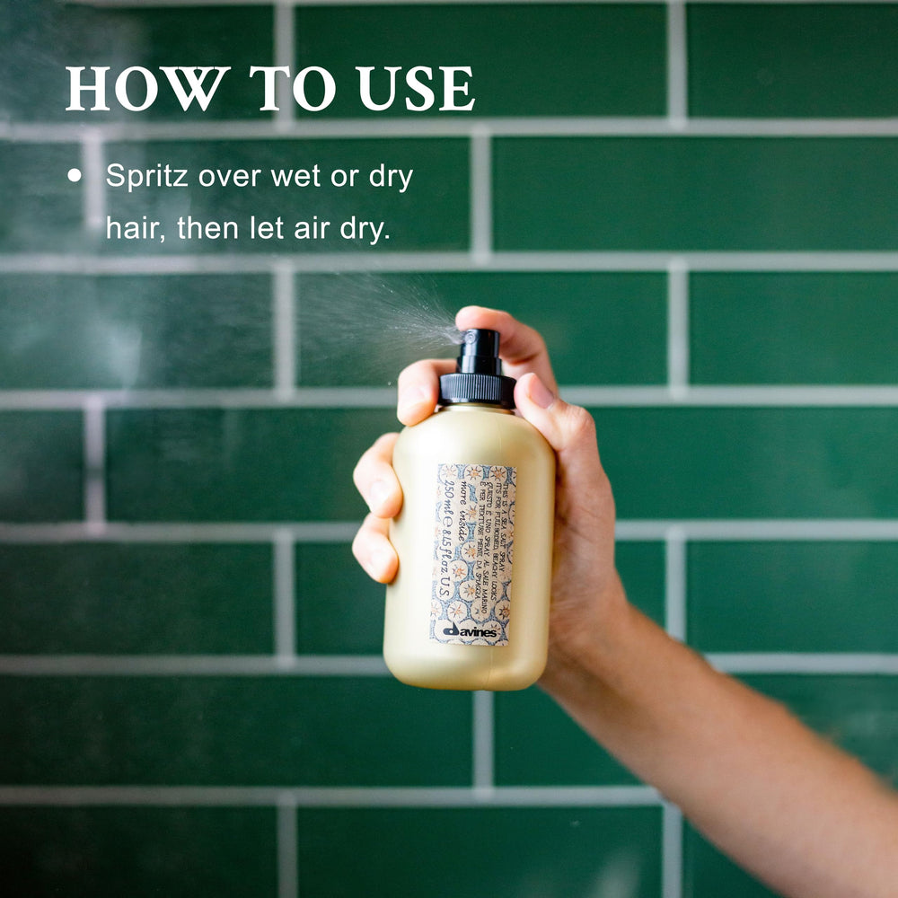 Damp hair ready to air-dry with Davines sea salt spray for volume.