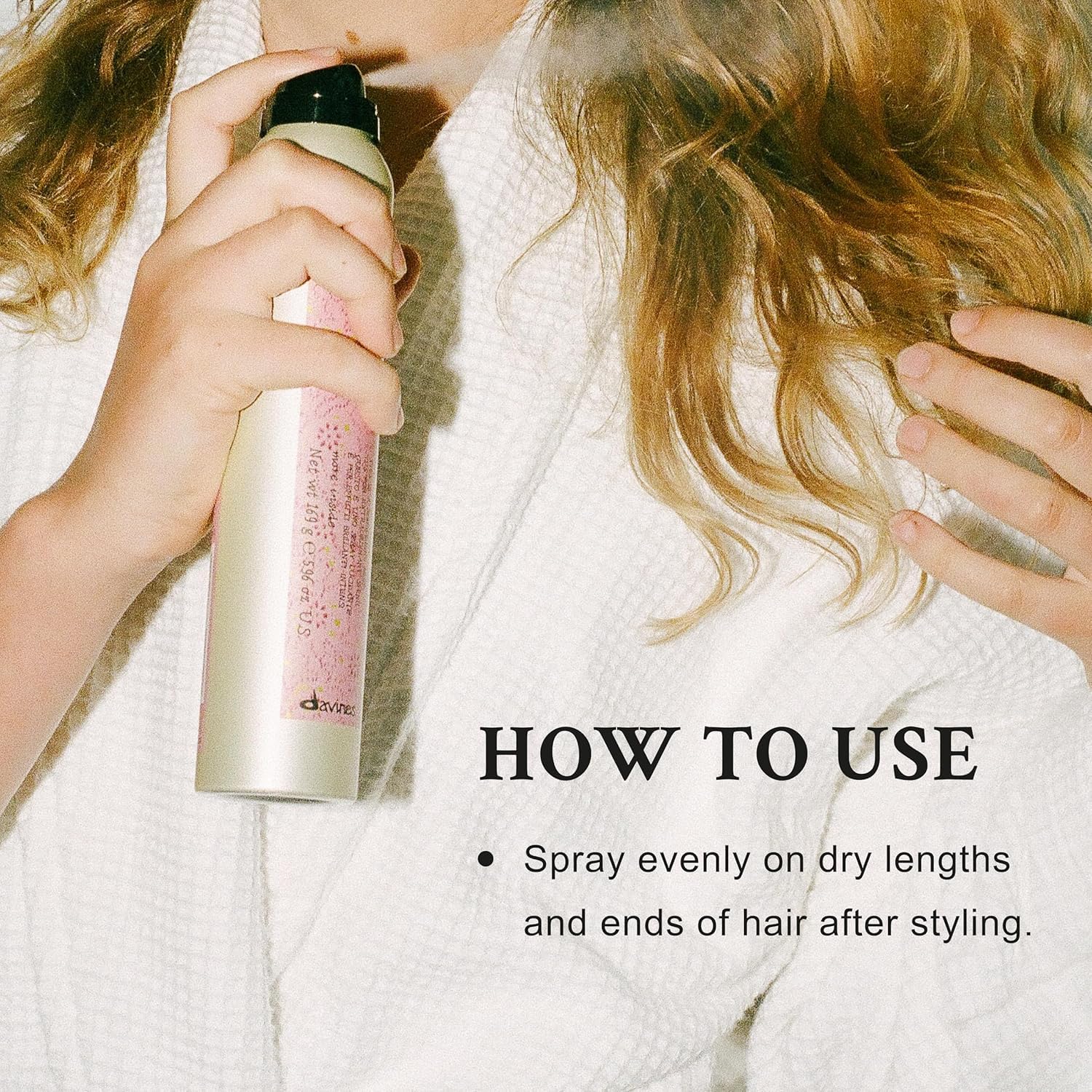 Davines This Is A Shimmering Mist being sprayed on damp hair for weightless shine.