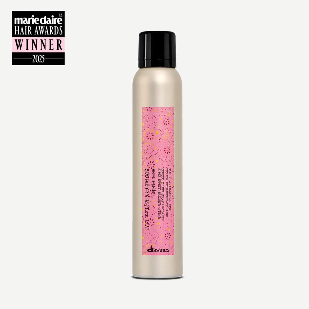 Davines This Is A Shimmering Mist spray releasing a fine mist for anti-frizz control.