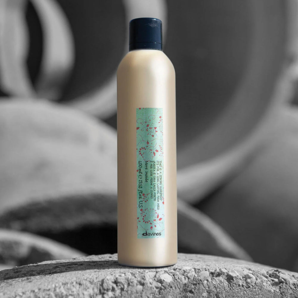 Davines This Is A Strong Hair Spray quick-dry spray sets looks without heaviness.