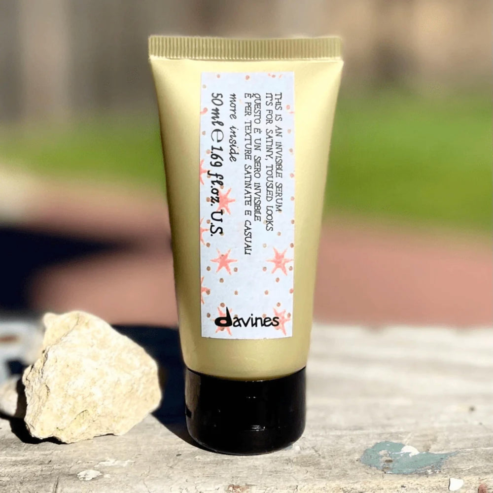 Davines This Is An Invisible Serum silky texture on clean hair.