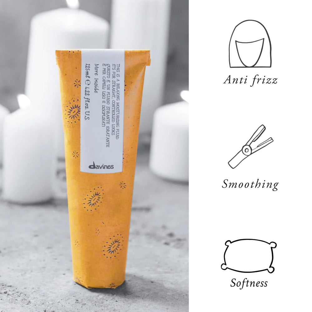 Davines This Is A Relaxing Moisturizing Fluid being applied to hair for frizz control