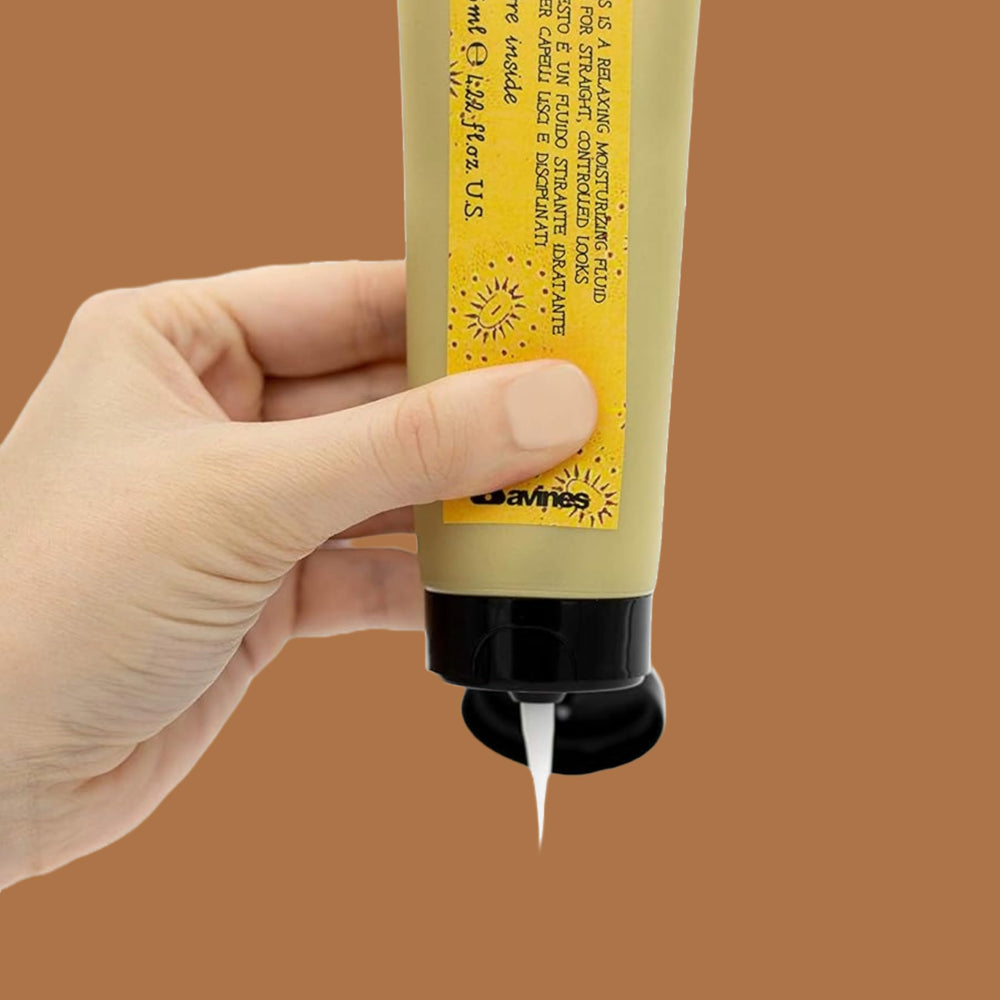 Davines This Is A Relaxing Moisturizing Fluid pump-dispense shows easy application