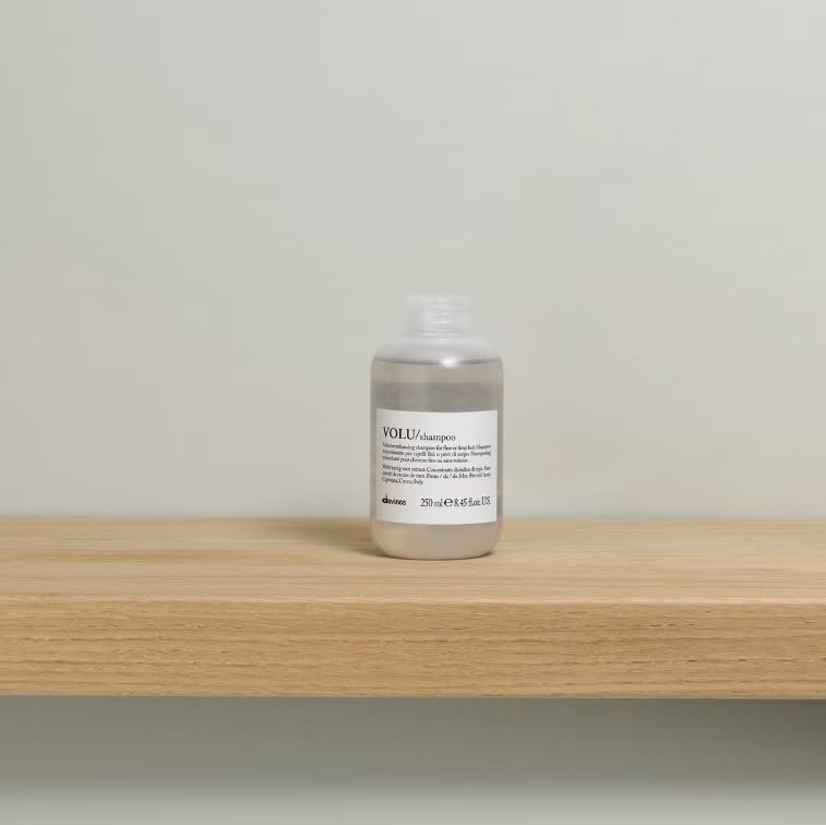 Davines VOLU shampoo foamy lather indicates gentle lift for fine hair.