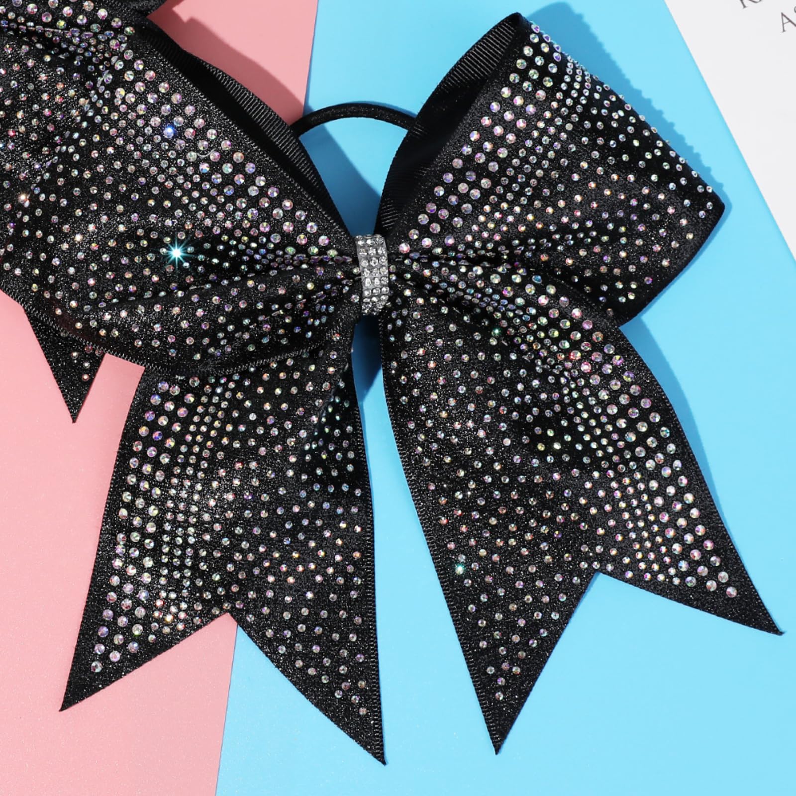 Bright glitter and rhinestones add sparkle to cheerleader ponytails