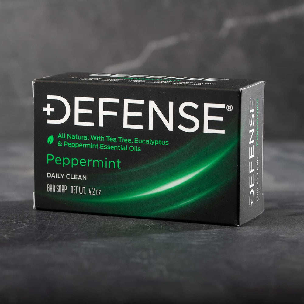 Defense Soap bar close-up on textured surface signaling high-rinse action