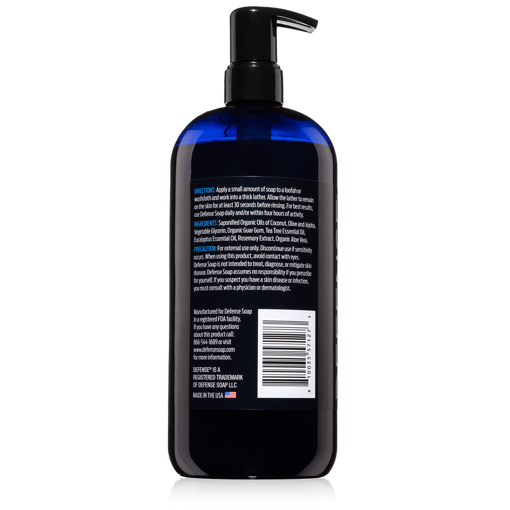 Family-size Defense Soap Tea Tree Body Wash bottle on bathroom shelf.