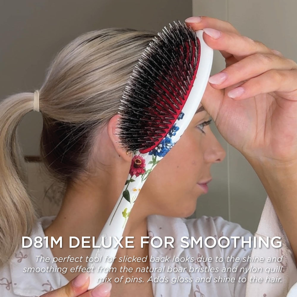 Denman D81M cushioned base detail for gentle brushing and reduced breakage.