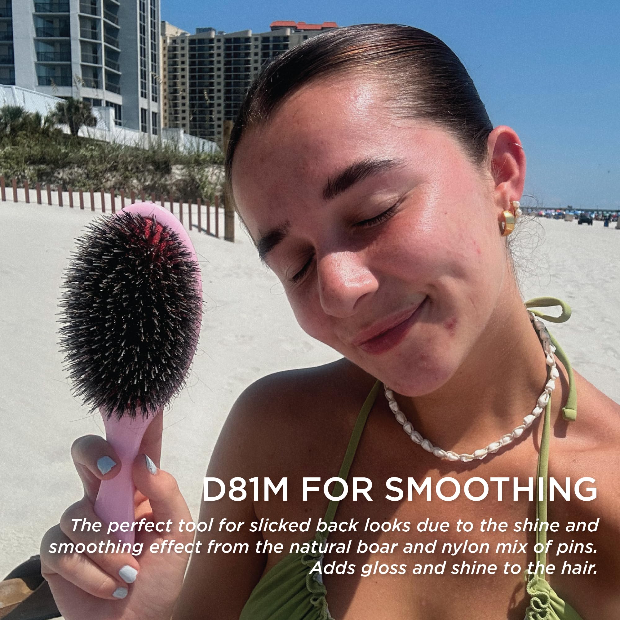 Denman Pink Crush brush gliding through hair for friction-free styling.