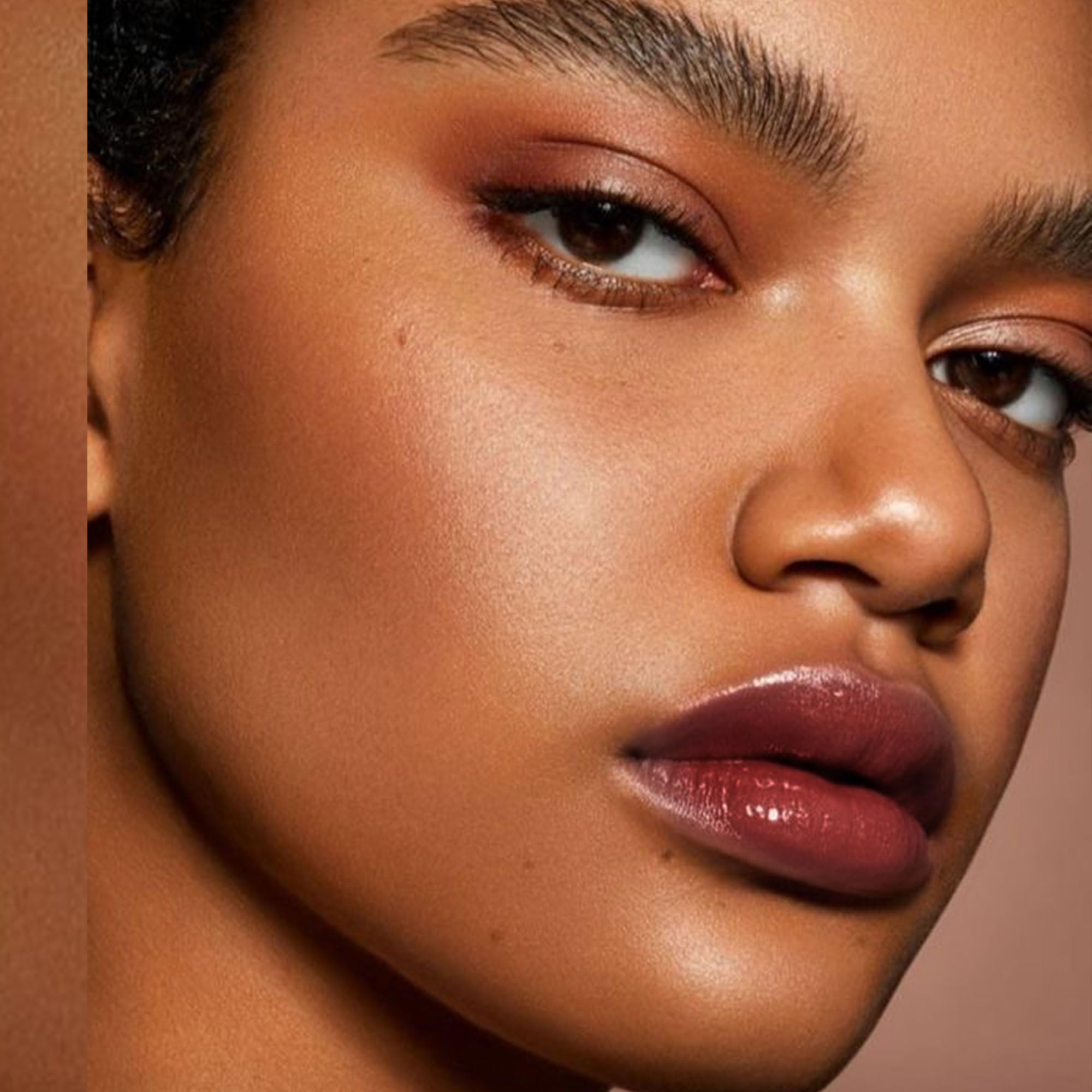 Depuplum Black Berry Lipstick with glossy finish for hydrated, radiant lips.