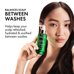 Dercos serum label closeup shows key ingredients and benefits
