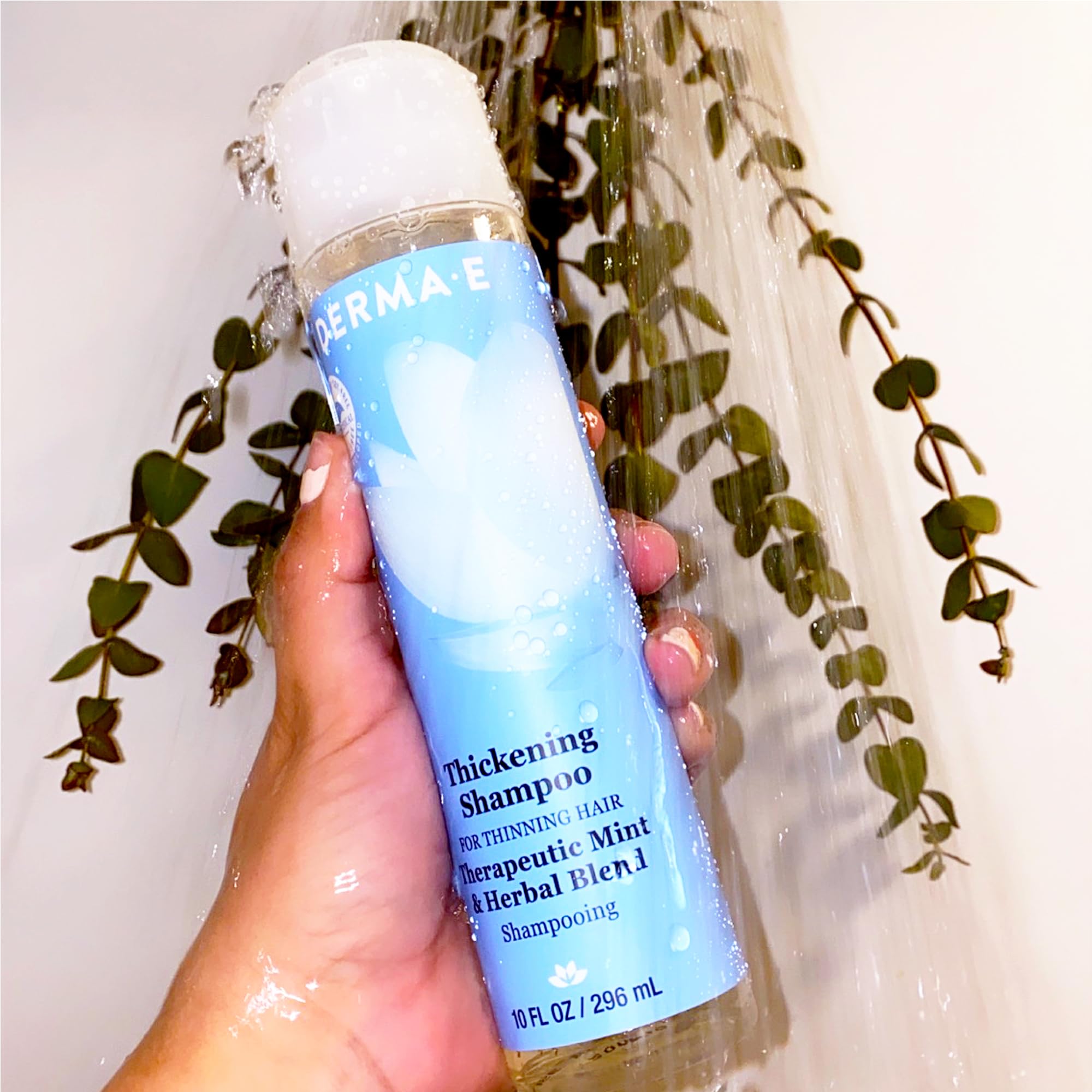 DERMA E Thickening Shampoo bathroom routine; on shelf with conditioner