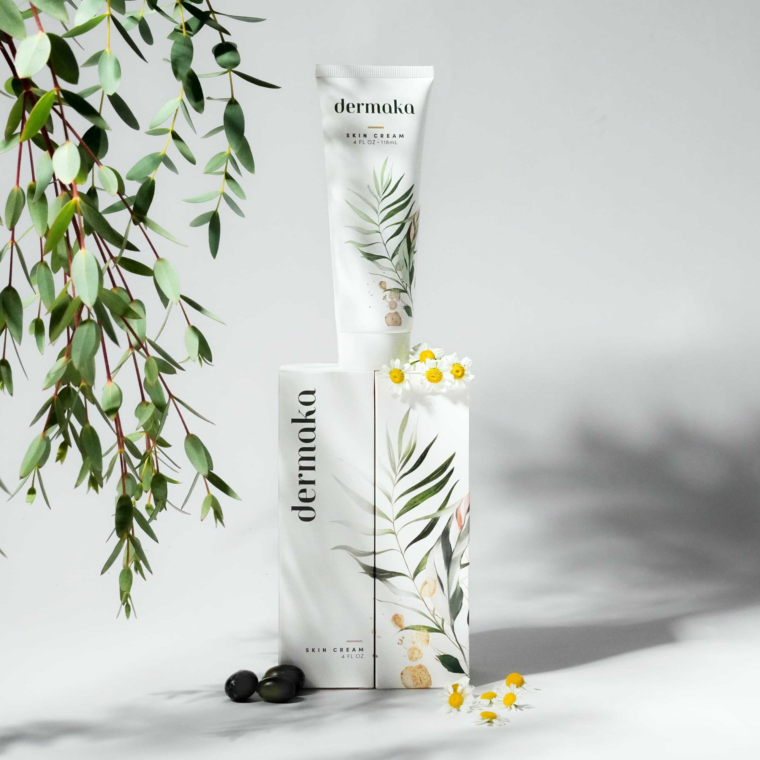 Dermaka cream on skin with soothing botanical extracts.