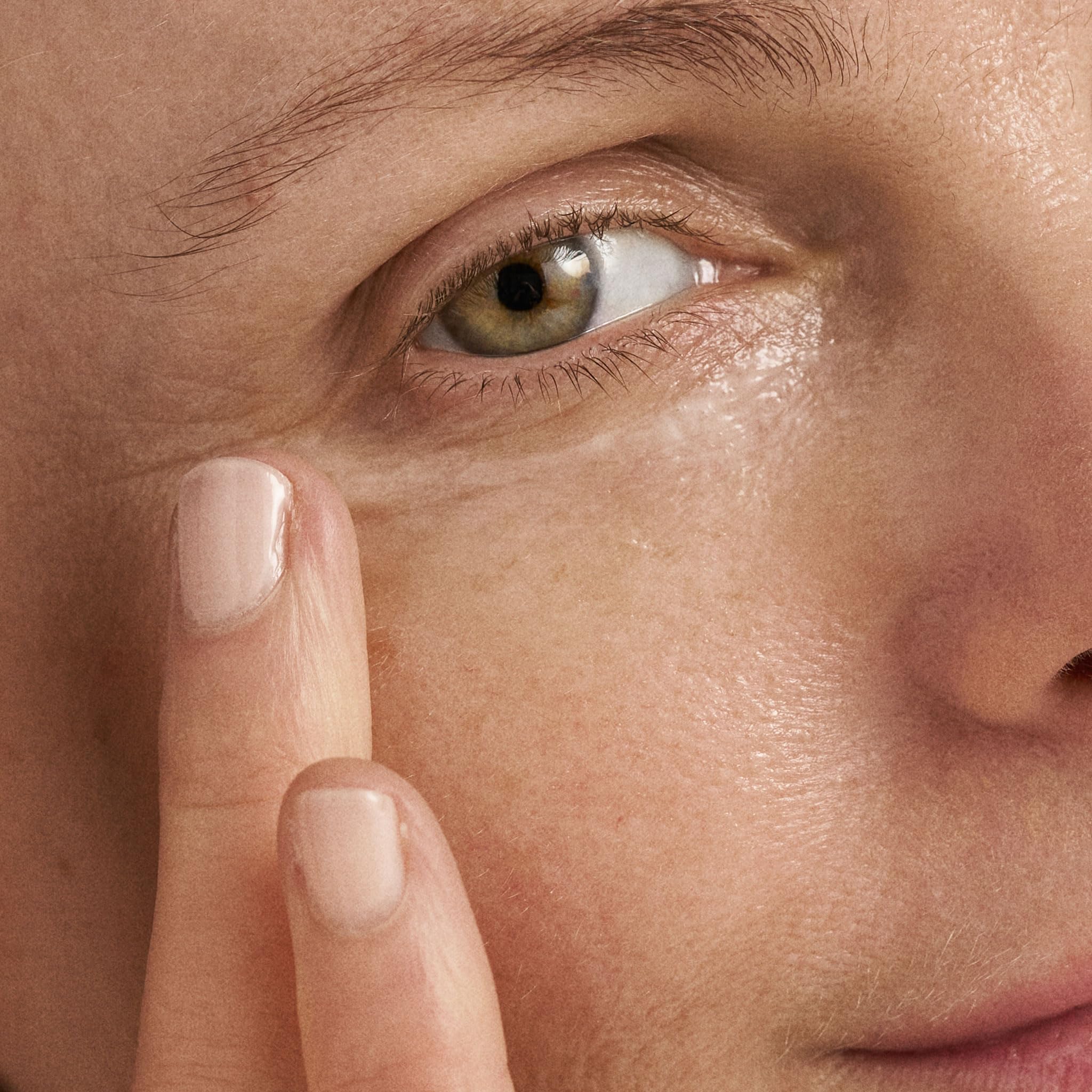 Dermalogica Age Reversal Eye Complex being gently applied around the eye contour.