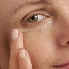 Dermalogica Age Reversal Eye Complex being gently applied around the eye contour.