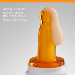 Under-eye application of Dermalogica Biolumin-C eye serum for smoother texture.