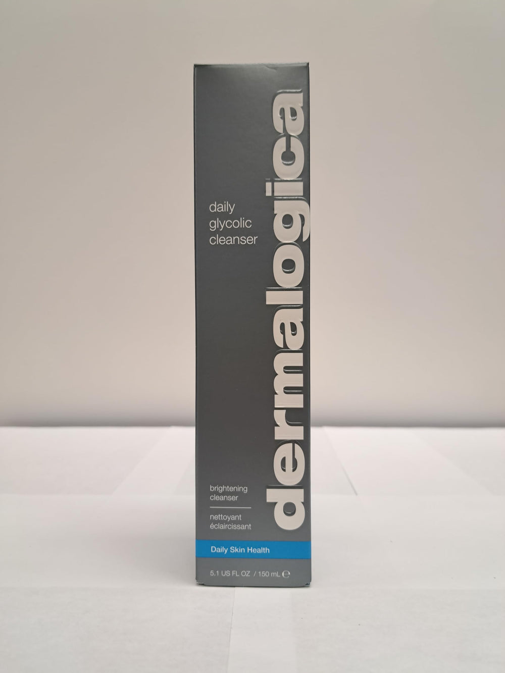 Product label close-up on Dermalogica Daily Glycolic Cleanser highlights glycolic acid.