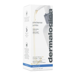 Applying PreCleanse on dry skin to dissolve makeup.