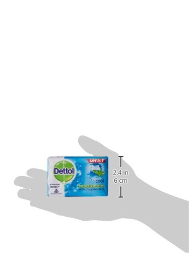 Dettol Cool Bar Soap sits on the bathroom shelf beside towels.