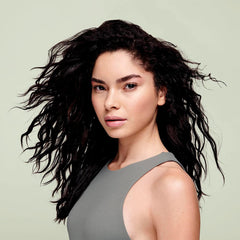 DevaCurl curly-definition closeup highlights touchable definition and clumped curls