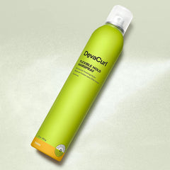 DevaCurl Hairspray Frizz-Control spray smooths flyaways without stiffness.