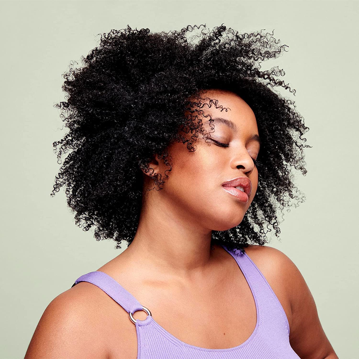 DevaCurl Leave-In Decadence Green Oasis apply-through curls showing definition and frizz control.