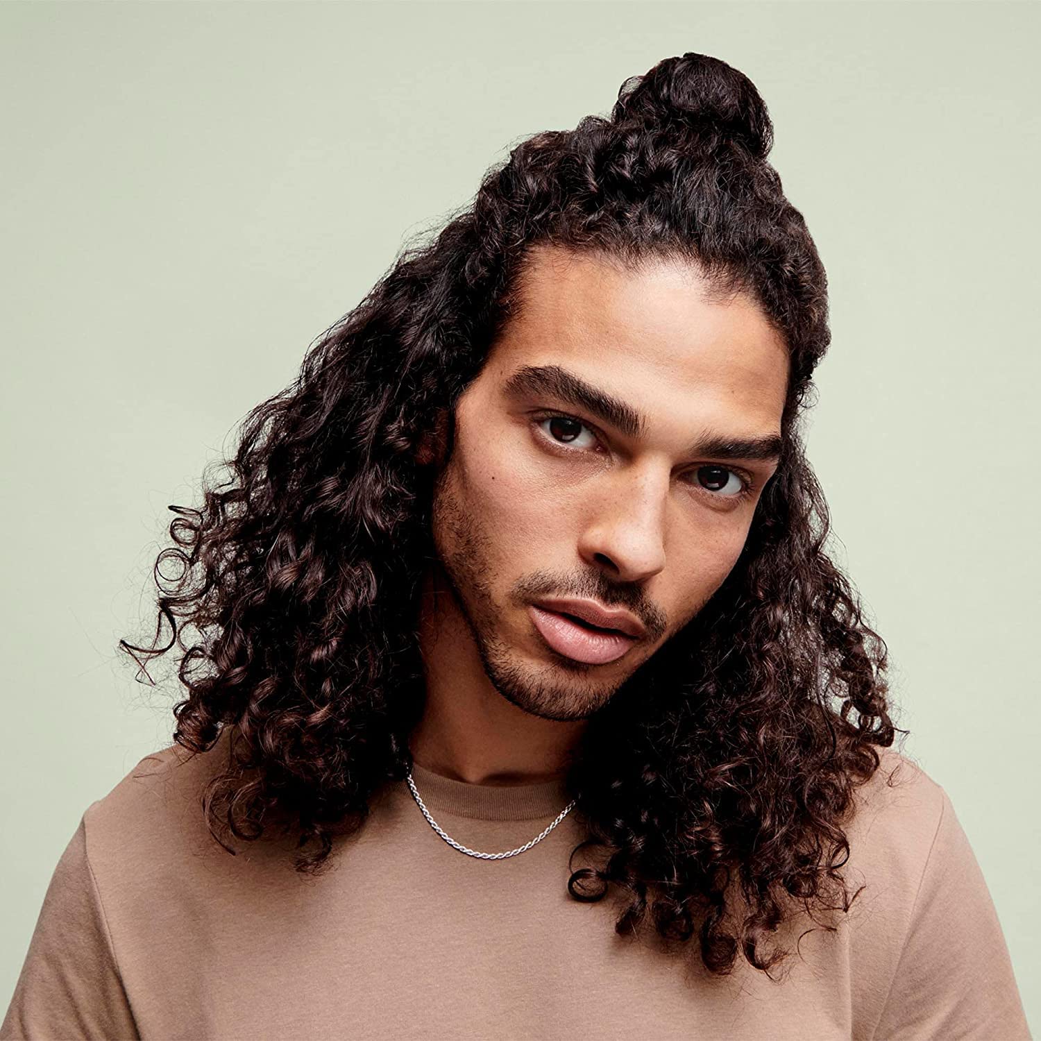 DevaCurl gel applied on damp hair to maintain moisture.
