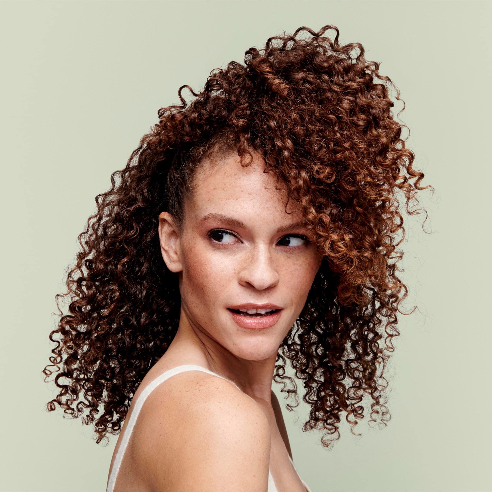 Hydrated curls with natural shine after using DevaCurl Low-Poo Original.
