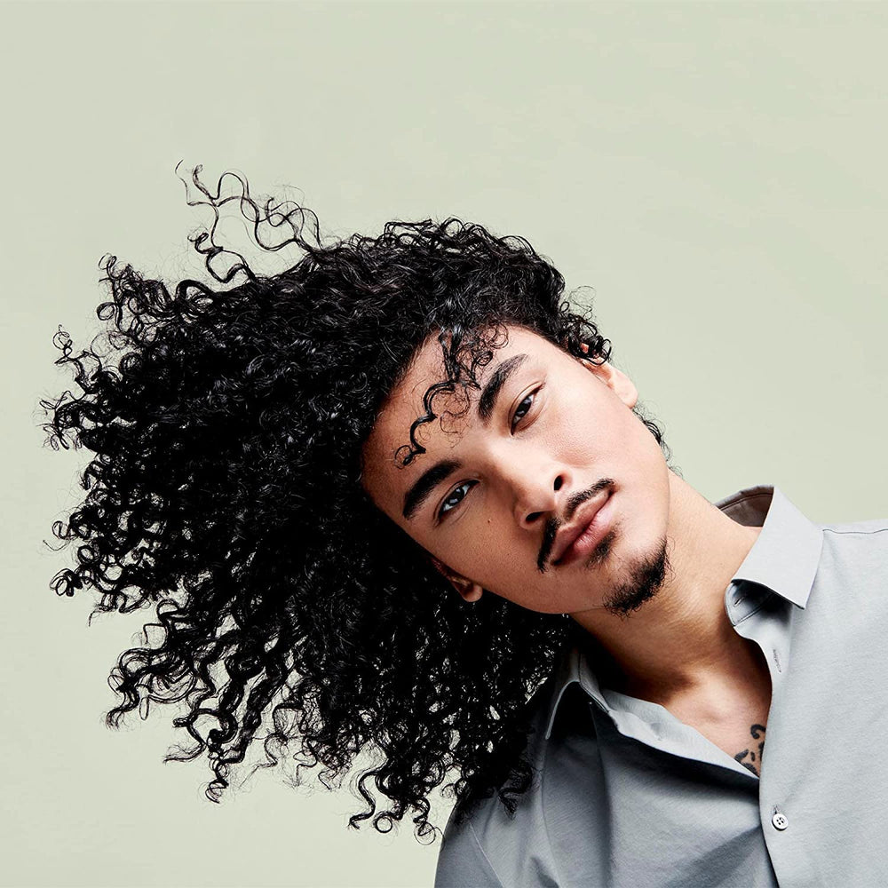 DevaCurl Moisture Seal frizz control close-up for sleek, defined curls.