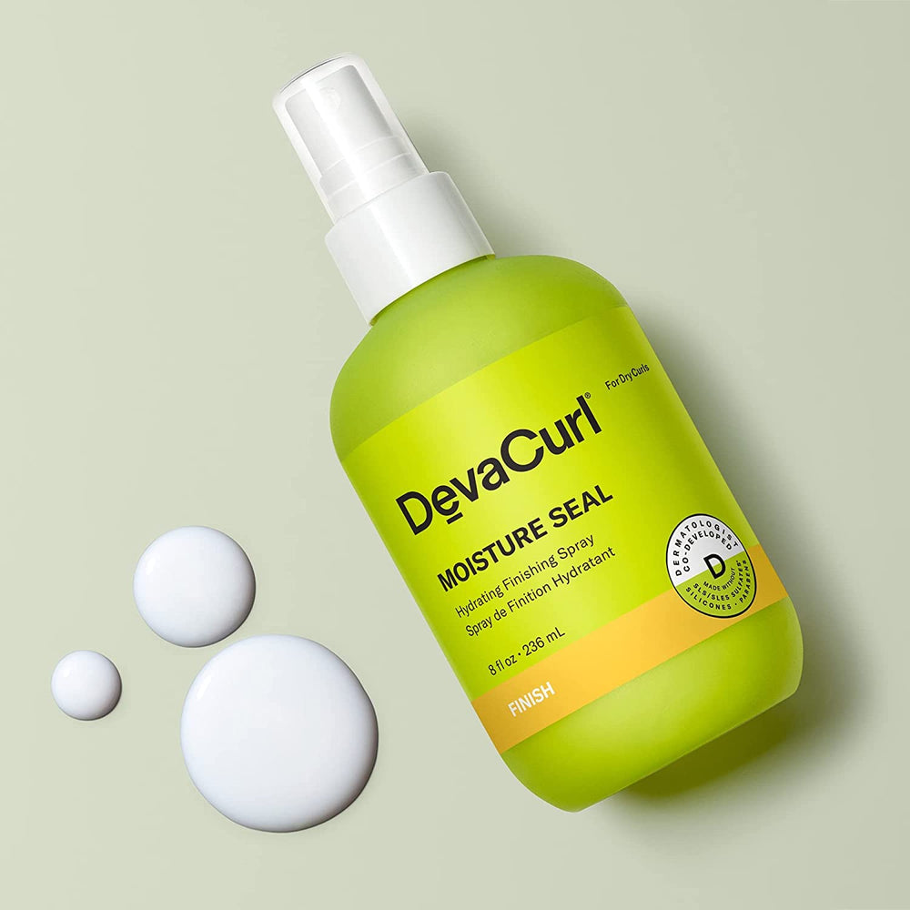 DevaCurl Moisture Seal spray application demonstrates even mist for frizz control.