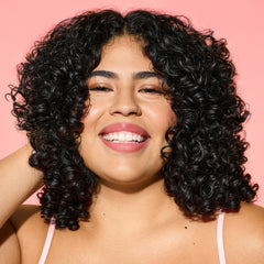 Close-up of One Condition texture showing creamy slip for detangling.