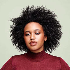 Rizos con brillo suave tras usar DevaCurl SuperCream.