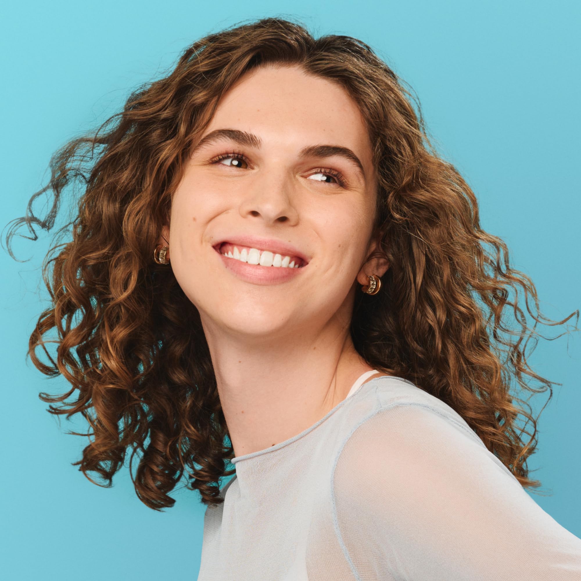 DevaCurl Wave Maker hair-waves shot showcasing enhanced curl body and shine.