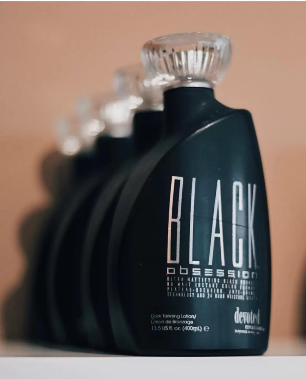 Devoted Creations Black Obsession Kakadu Plum image emphasizes tone protection and skin comfort.