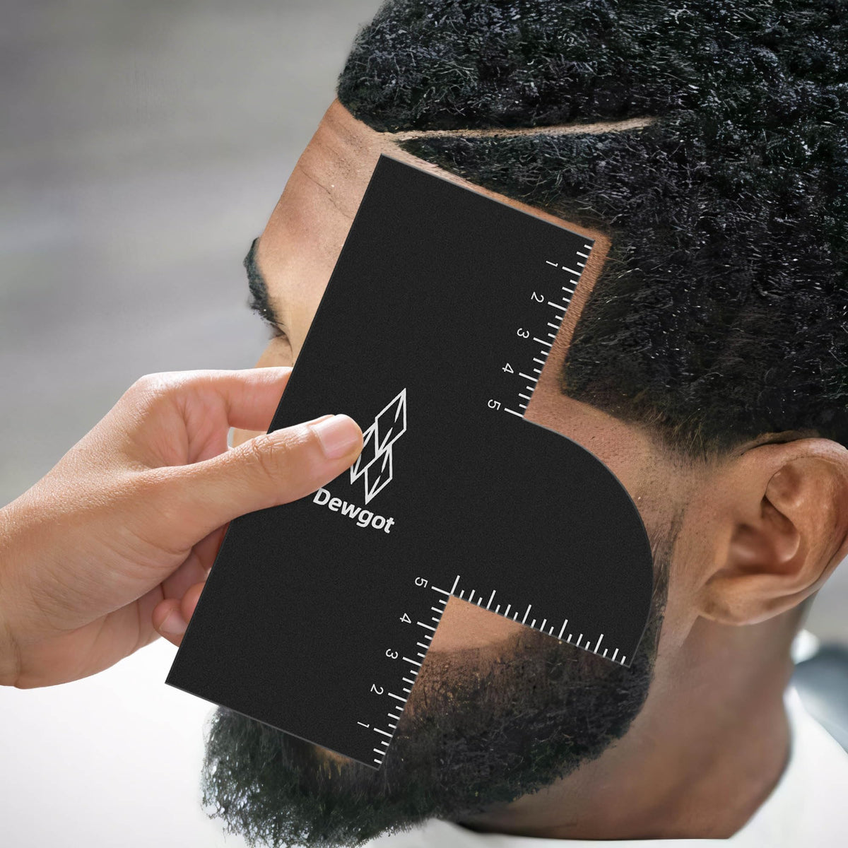 Dewgot Enhancement Card with measurement indicators for precise symmetry during cuts.