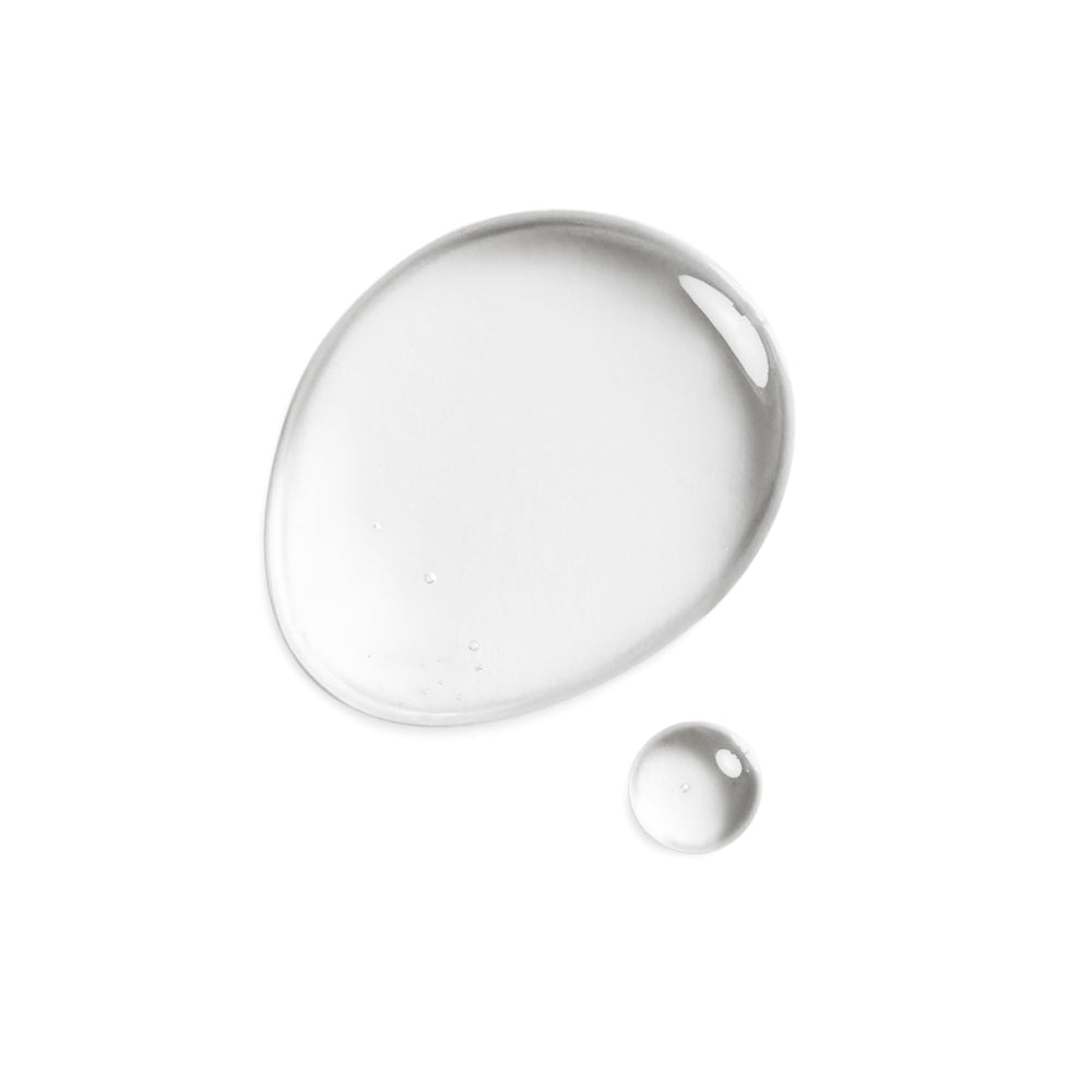 DHC Olive Virgin Oil on face demonstrates fragrance-free, colorant-free formula.