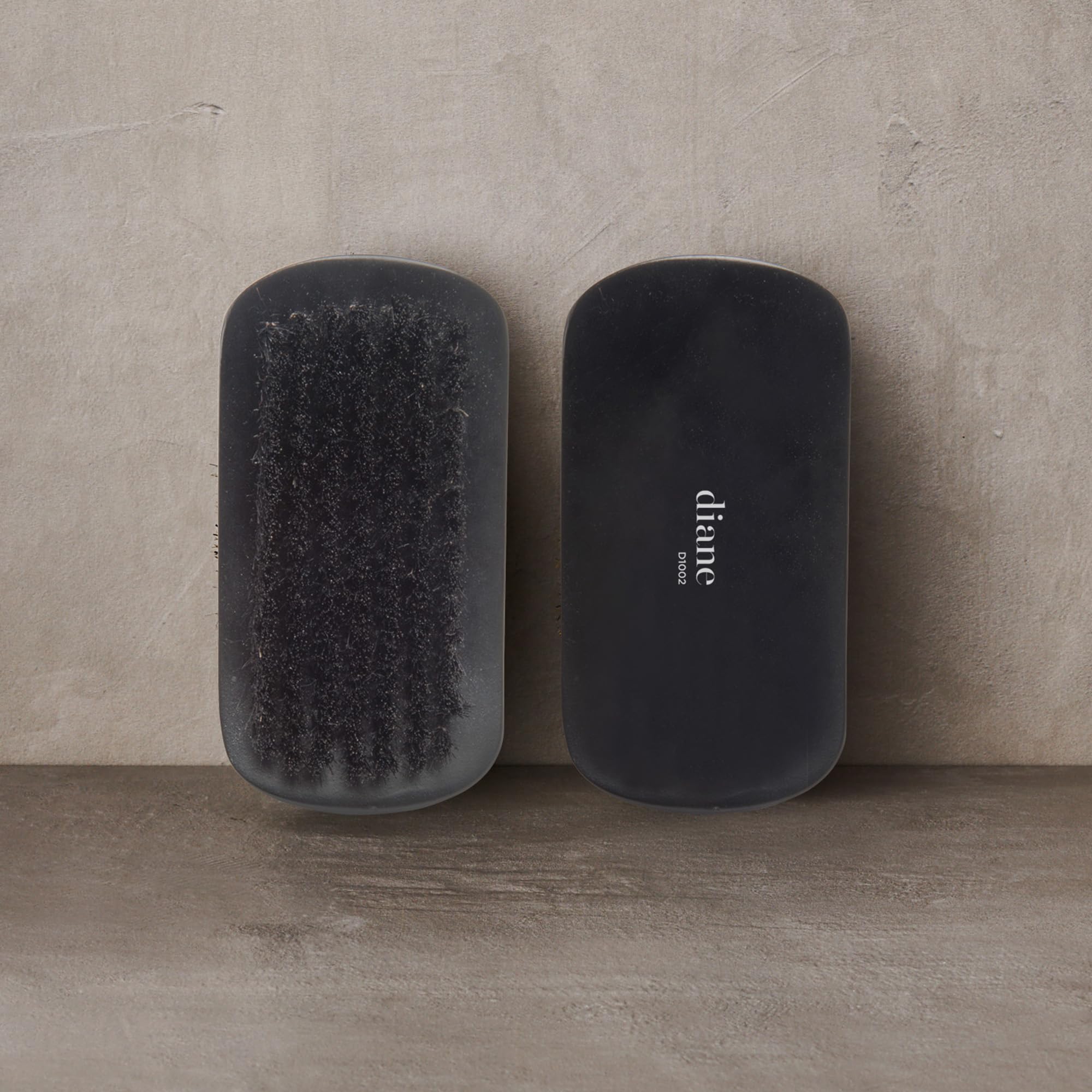 Diane boar bristle curved brush wave-styling close-up for deeper wave definition.