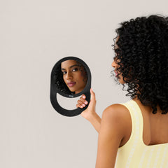 Diane hand mirror with hold-and-hang design offers flexible use at home or in the salon.