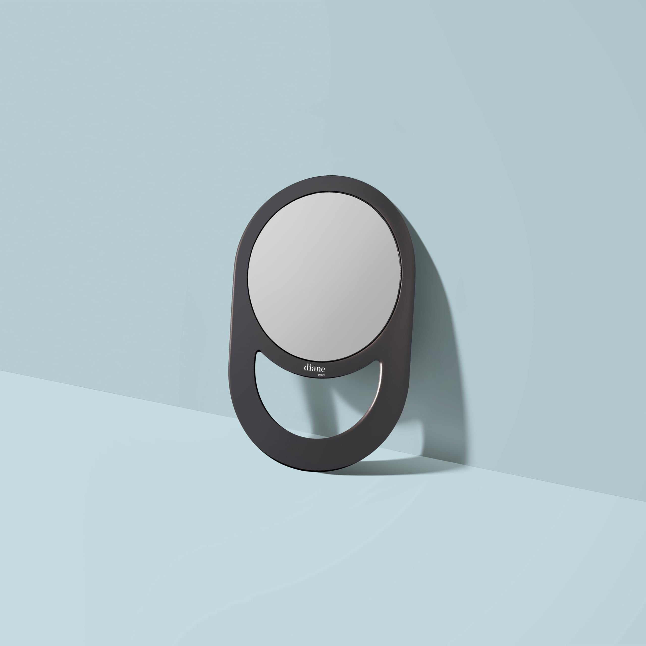 Diane hand mirror features a seven-and-a-half-inch diameter viewing area for full facial visibility.