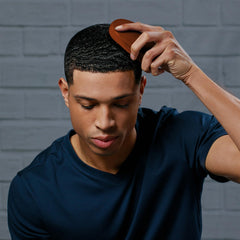 Diane Premium Boar Military Wave Brush smoothing textured hair during styling.