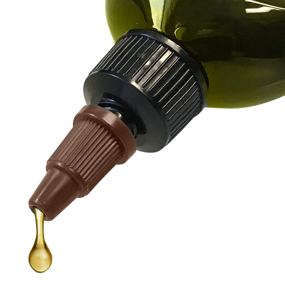 Difeel Progrowth oil texture close-up highlights lightweight, non-greasy feel on hair.