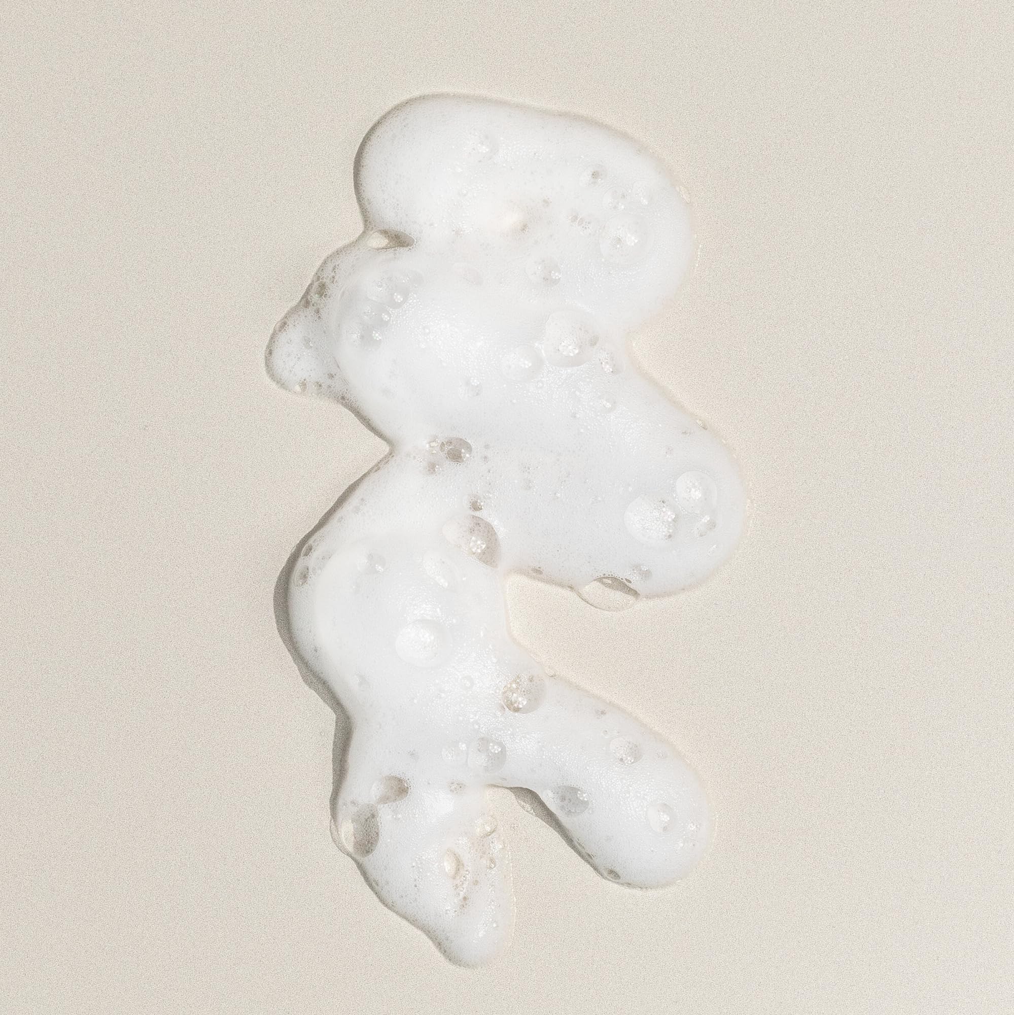 DIME Beauty Creamy Foam Cleanser 4 oz bottle on vanity.