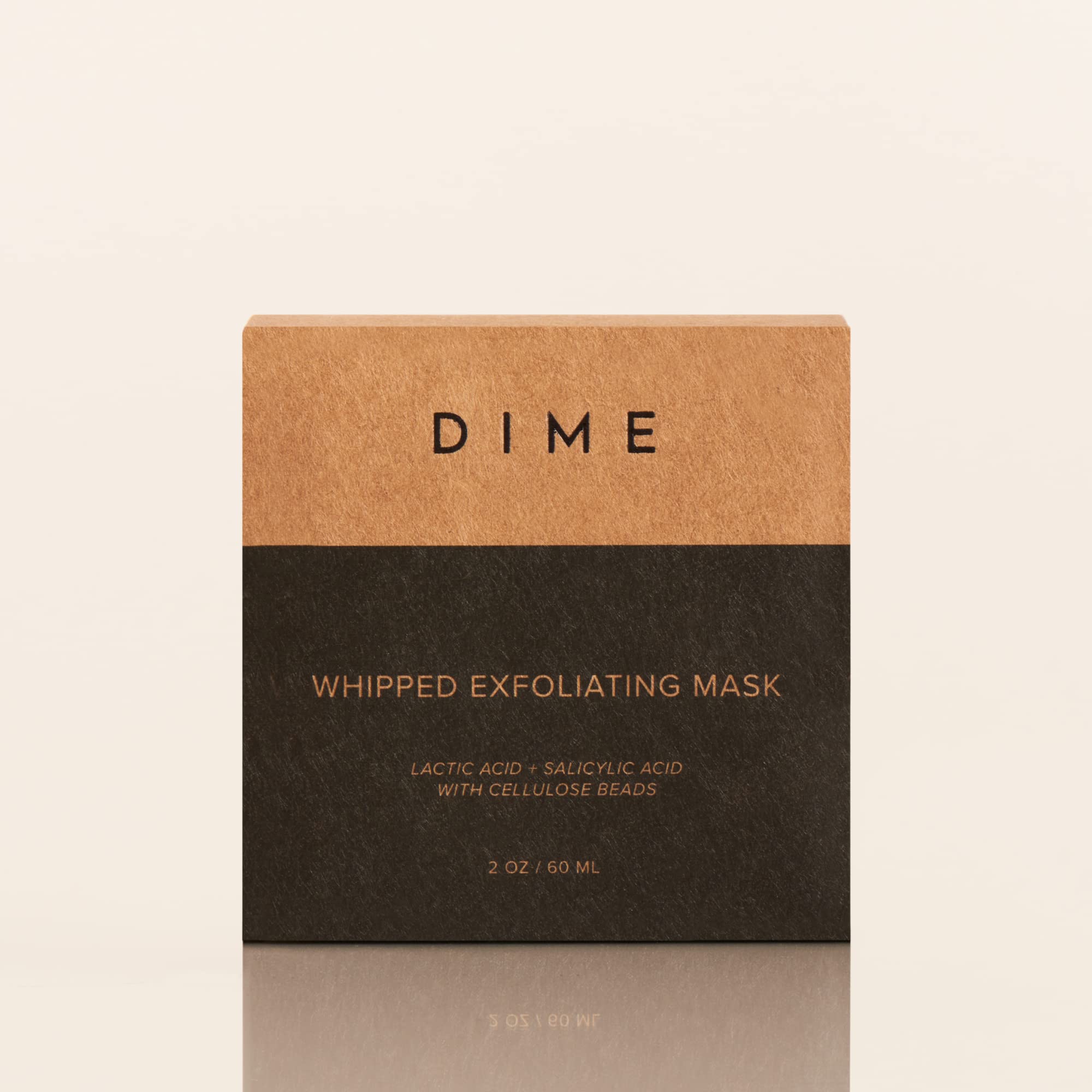 DIME whipped exfoliating mask in hand shows creamy texture ready.