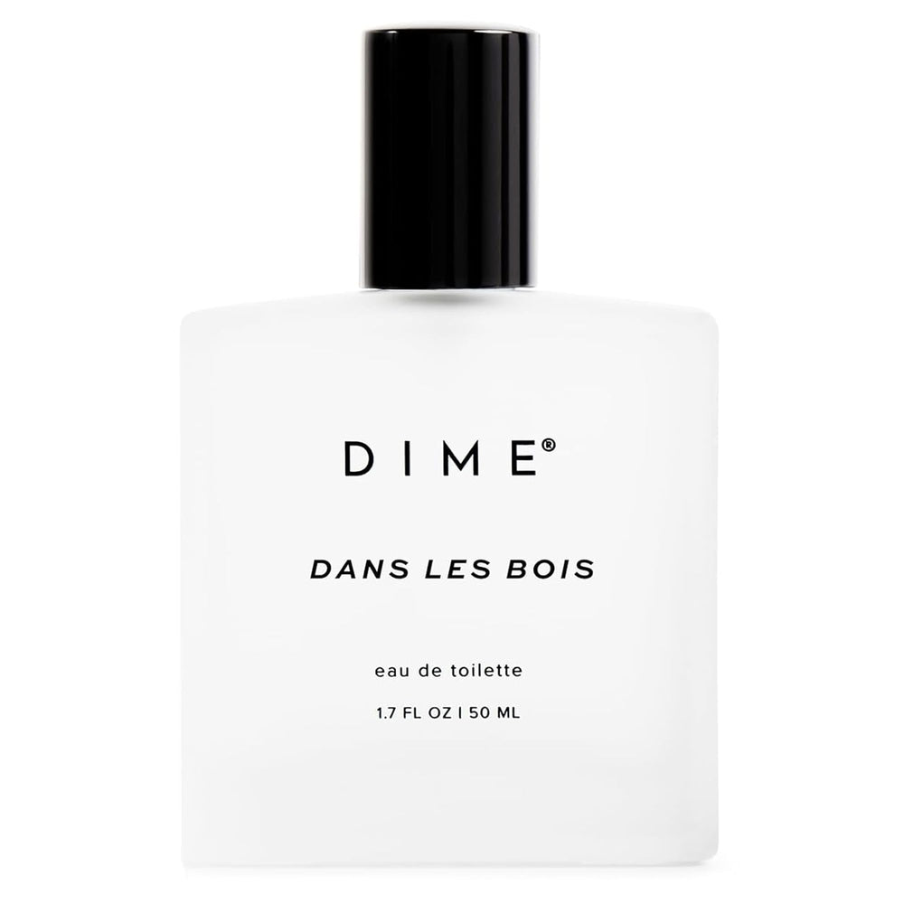 DIME Dans Les Bois bottle front shows woody-floral scent for daily wear