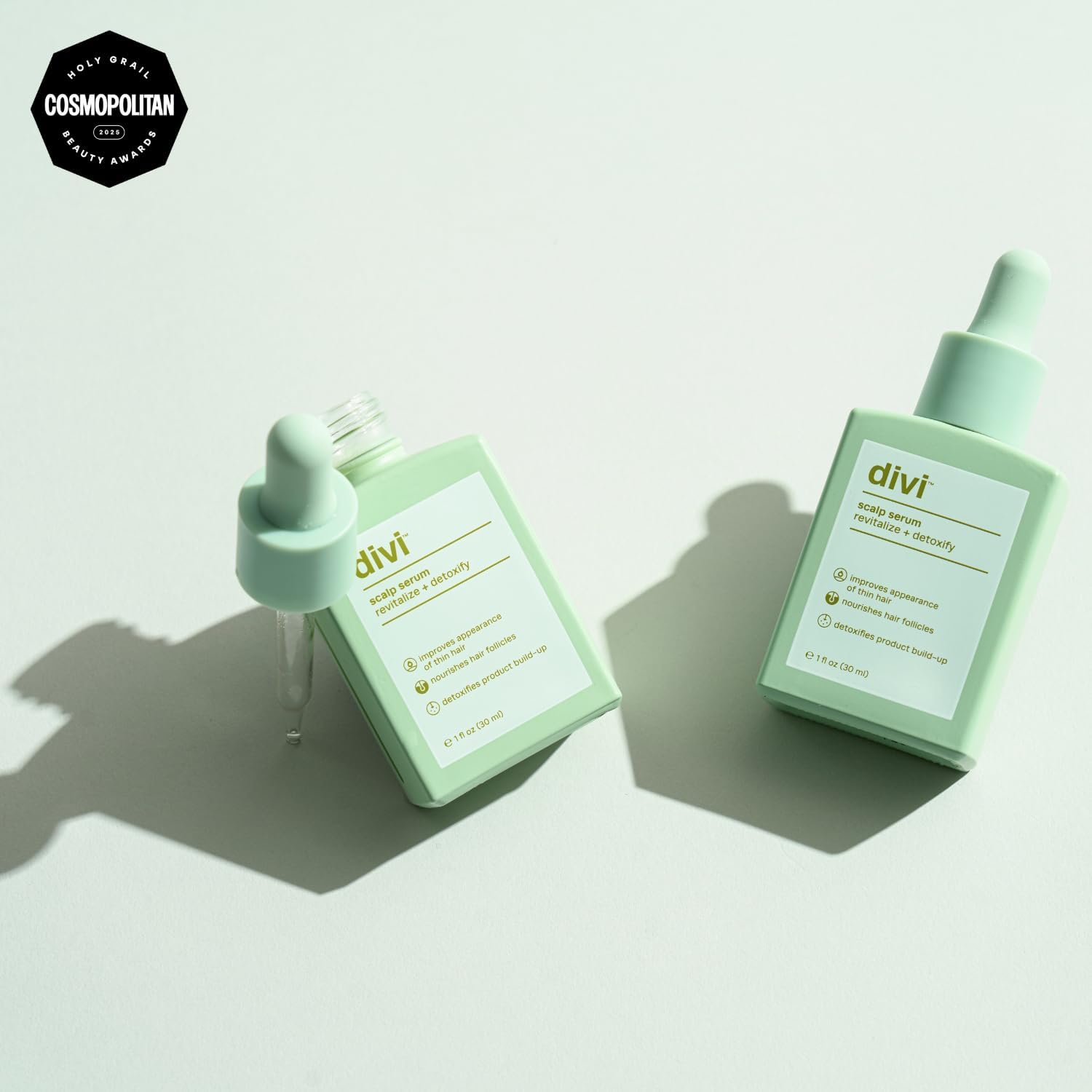 Divi Scalp Serum dropper applying precise dose for thinning areas.