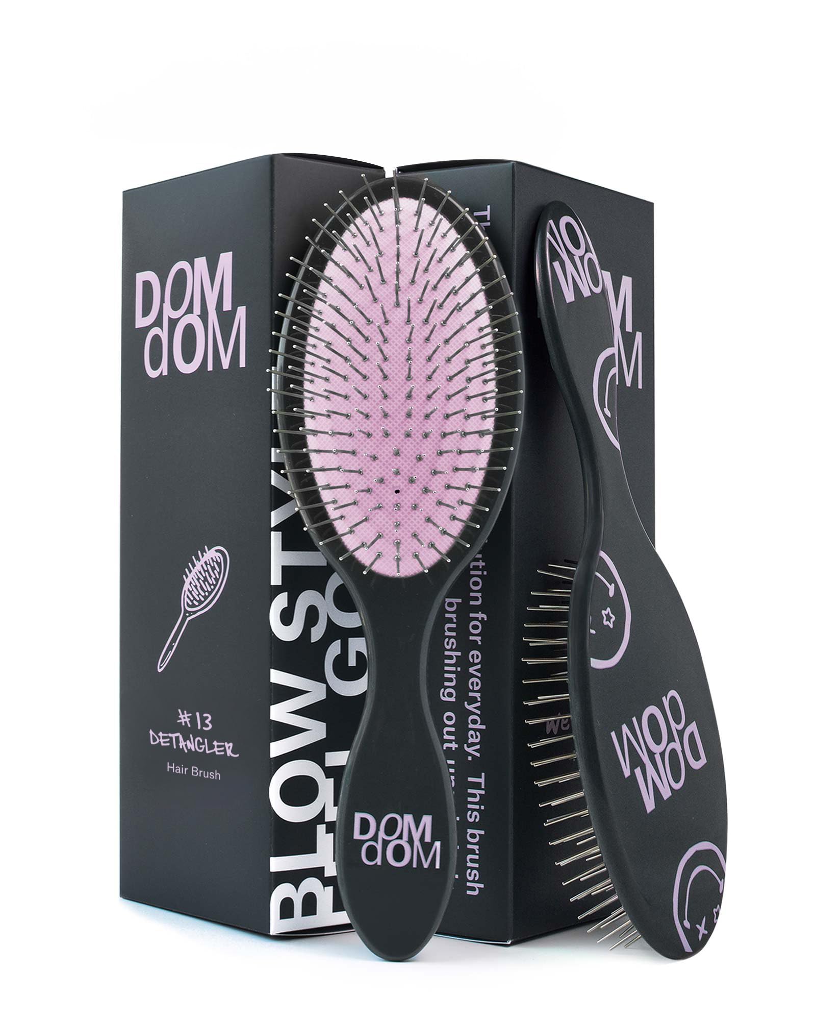 Dom Dom detangling brush with drainage hole for fast drying after shower.