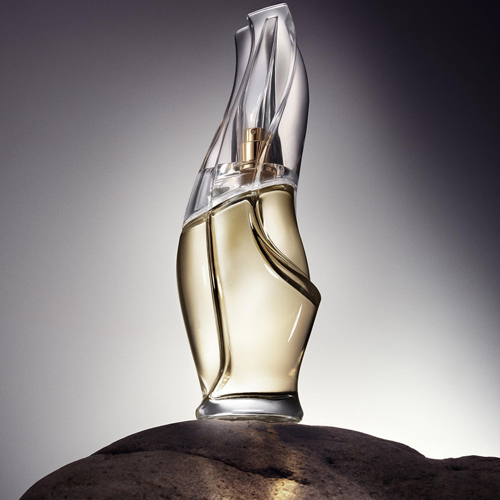 Cashmere Mist bottle against soft fabric backdrop for luxurious mood