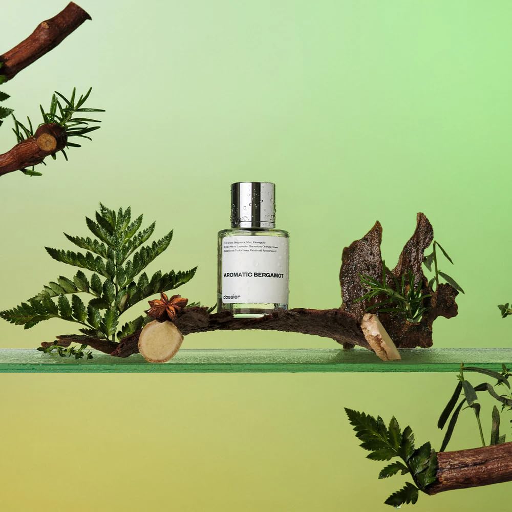 Dossier Aromatic Bergamot heart notes transition to a floral kiss.