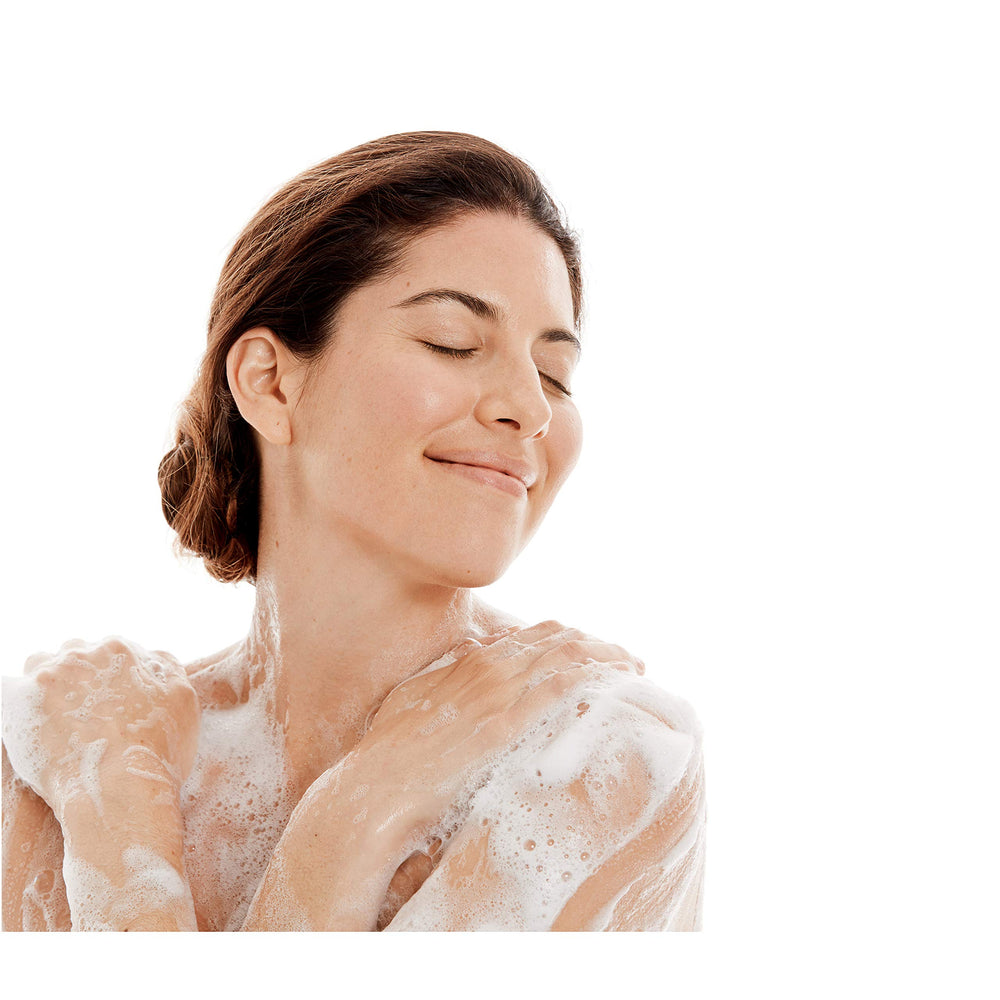 Dove body wash in shower scene conveys daily refreshing cleanse