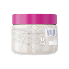 Dove Exfoliante Corporal Fruta Dragón Coco, textura espumosa para limpieza suave.